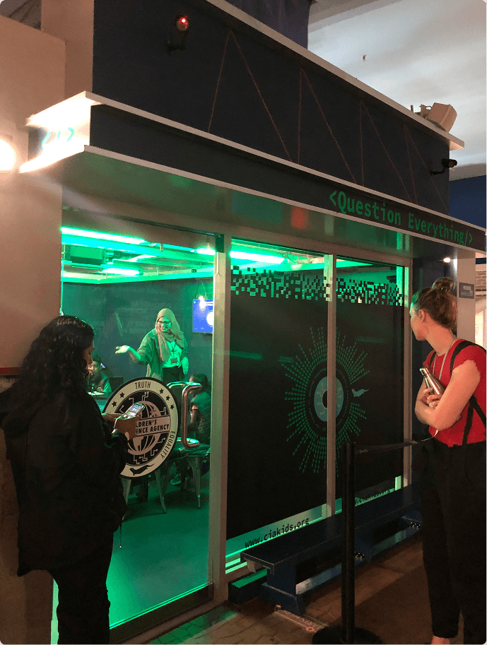 The unit's exterior at a shopping centre location, with visitors queuing outside