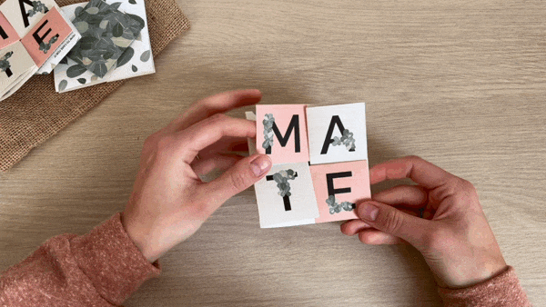 An animated GIF of hands unfolding the Yerba Mate Set companion leaflet, revealing each folded section in turn
